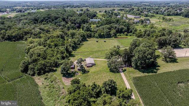 an aerial view of a houses with outdoor space
