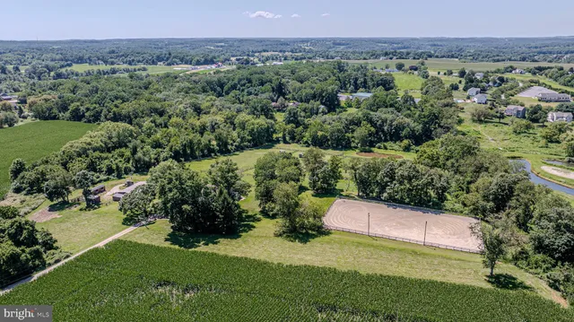 an aerial view of a houses with a yard
