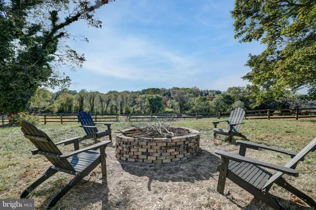 a bedroom with a large bed and a flat tv screen on dresser