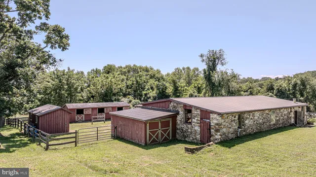 a view of a house with patio and a yard