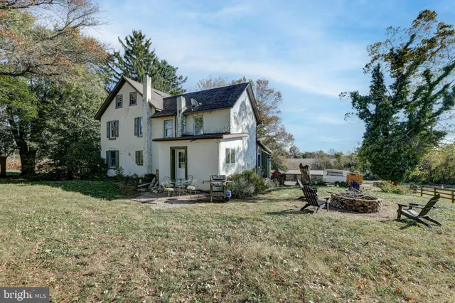 a bathroom with a sink a mirror and a shower