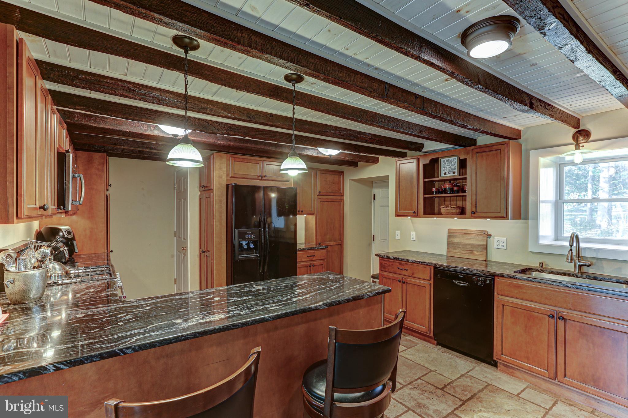 1427 Flint Hill Road Landenberg, PA 19350 - Photo 56 of 85 Charming kitchen with rustic wooden beams.