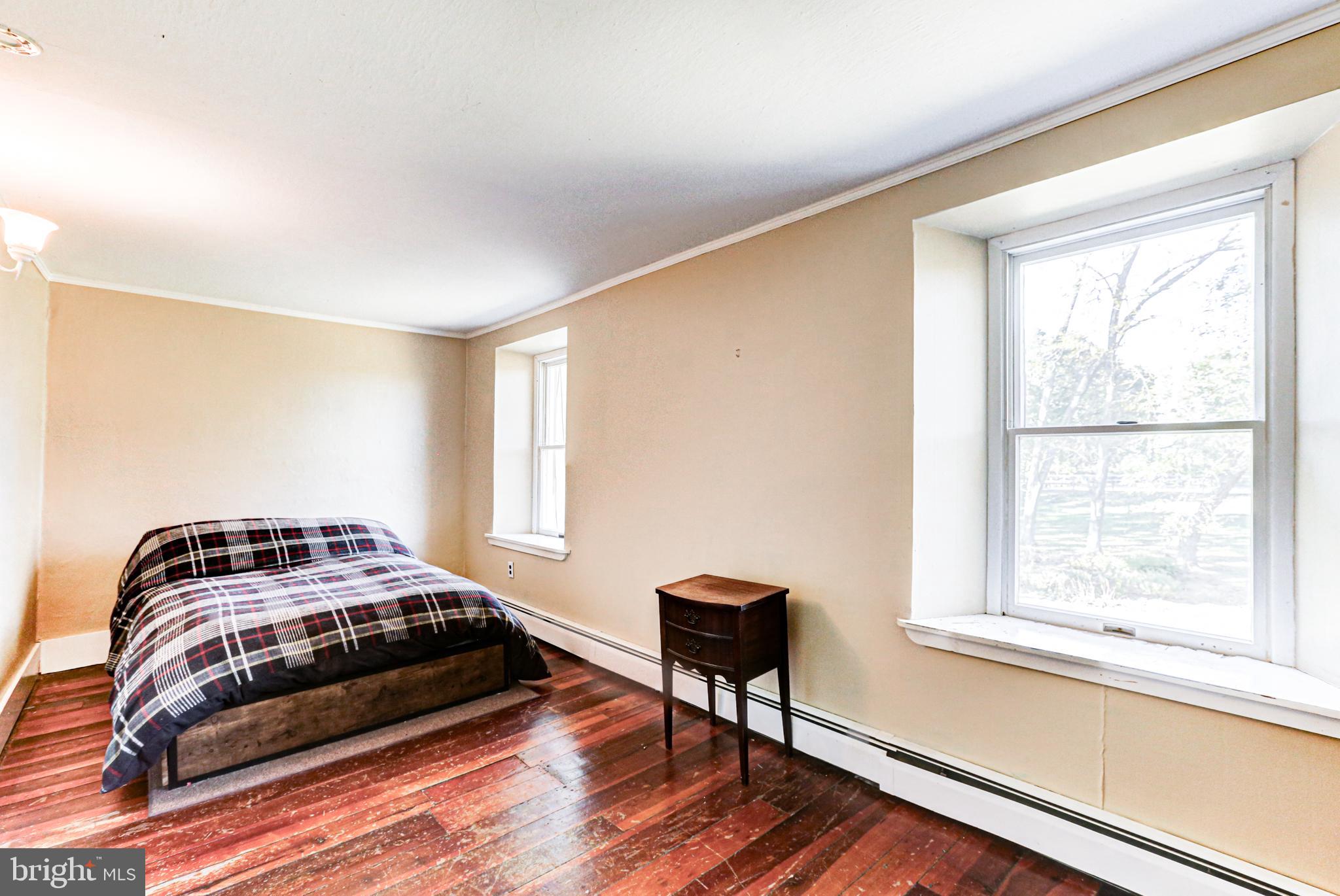 1427 Flint Hill Road Landenberg, PA 19350 - Photo 71 of 85 a bedroom with a bed and a window