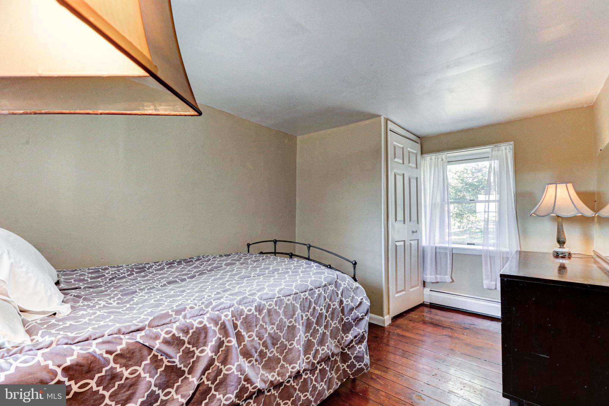 1427 Flint Hill Road Landenberg, PA 19350 - Photo 77 of 85 a bedroom with a bed and a window