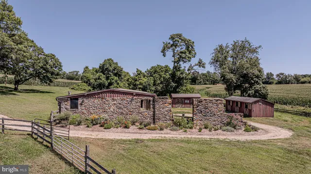 an aerial view of a houses with outdoor space