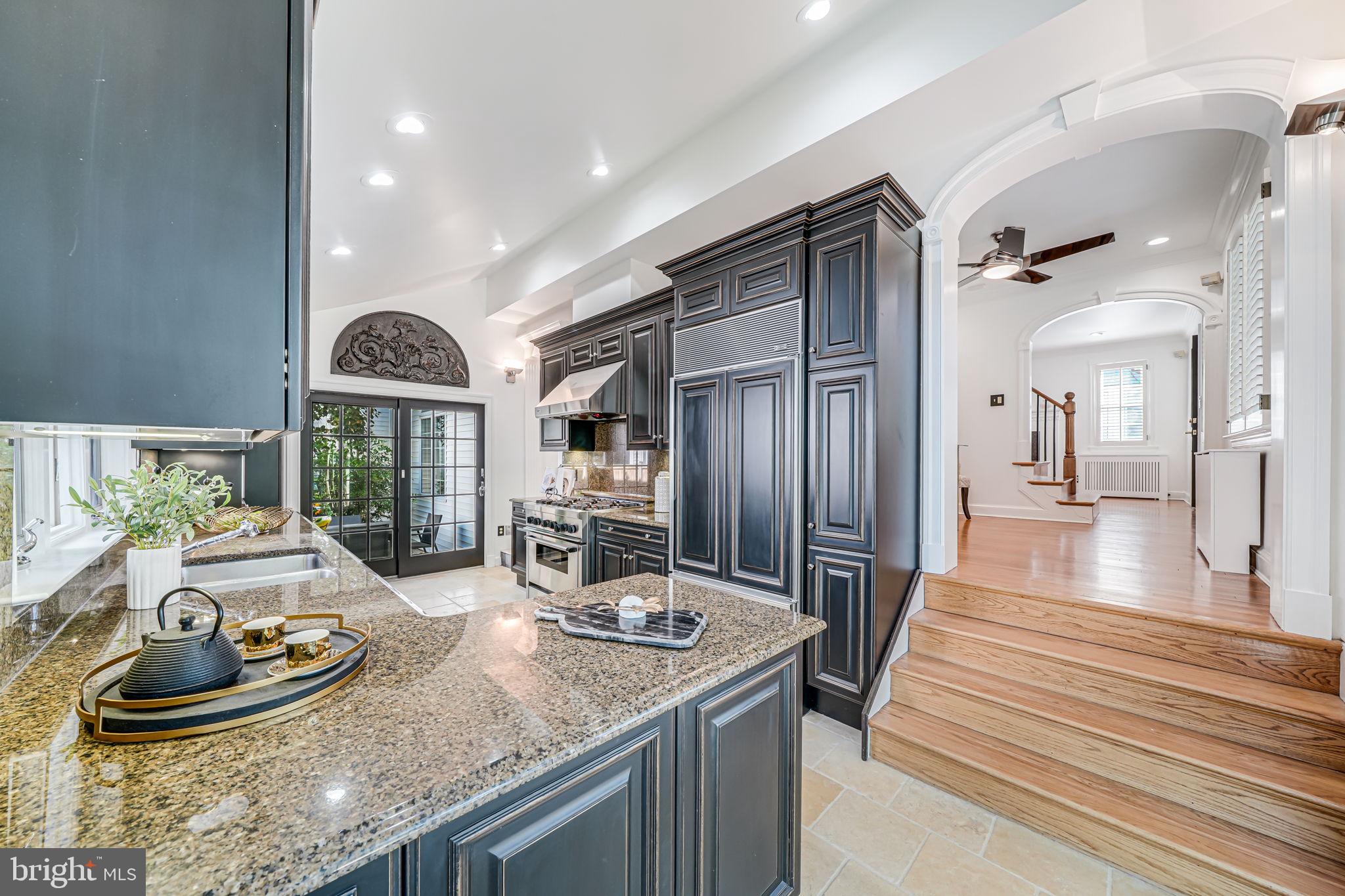 4817 Chevy Chase Boulevard Chevy Chase, MD 20815 - Photo 19 of 78 a kitchen with granite countertop stainless steel appliances and wooden floor