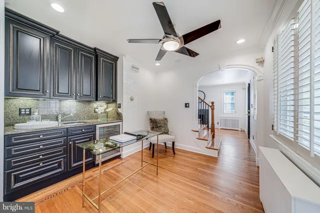 a kitchen with stainless steel appliances kitchen island granite countertop a stove and a refrigerator