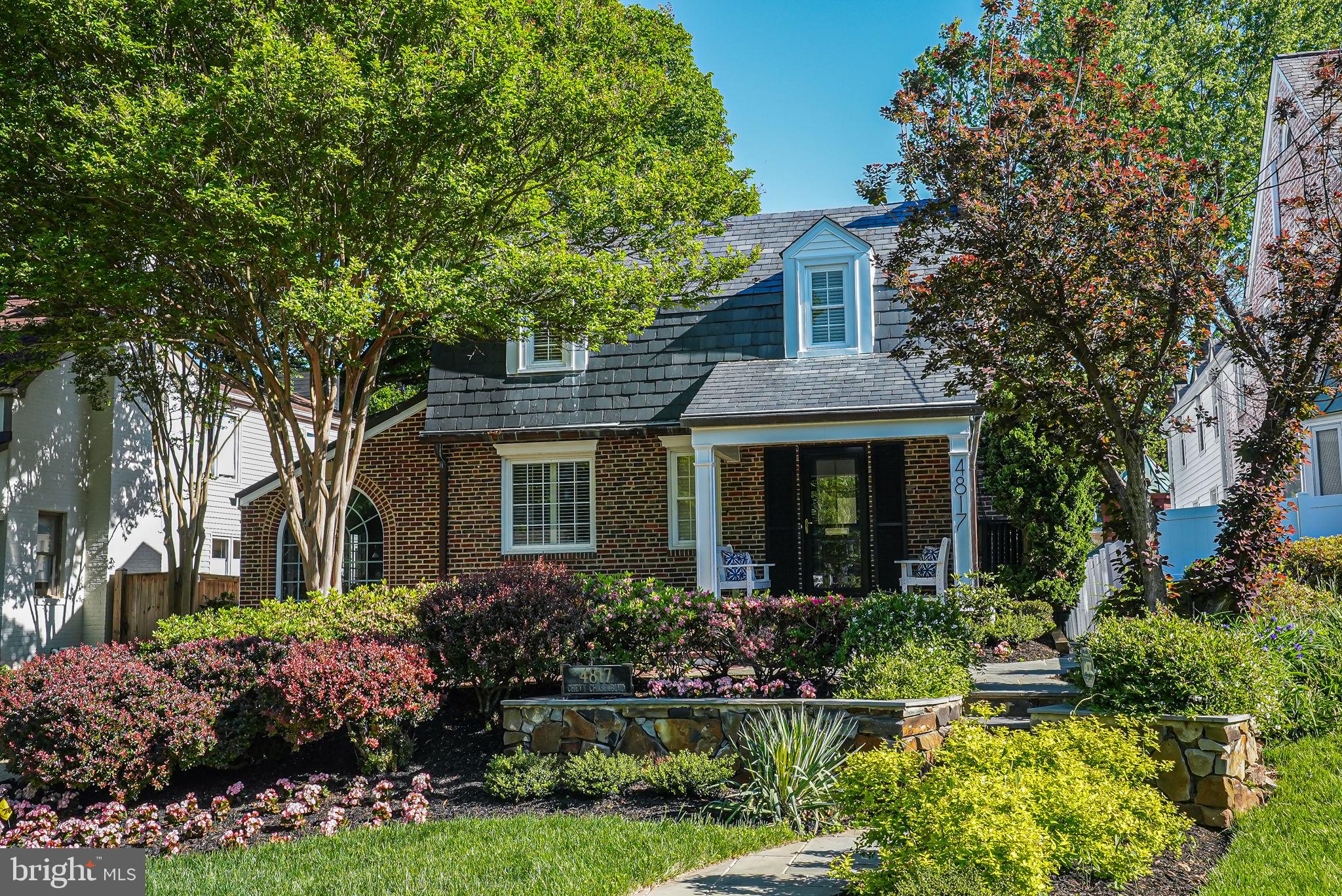 4817 Chevy Chase Boulevard Chevy Chase, MD 20815 - Photo 2 of 78 a front view of a house with a yard