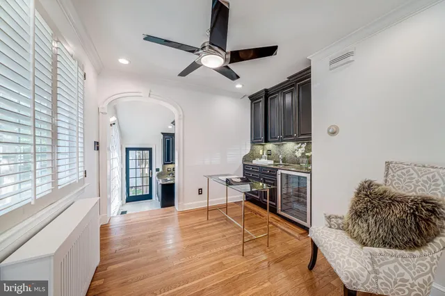 a view of a room with furniture and wooden floor