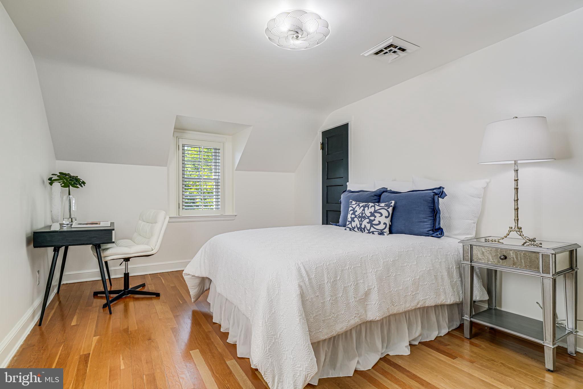 4817 Chevy Chase Boulevard Chevy Chase, MD 20815 - Photo 25 of 78 a bedroom with a bed and a table