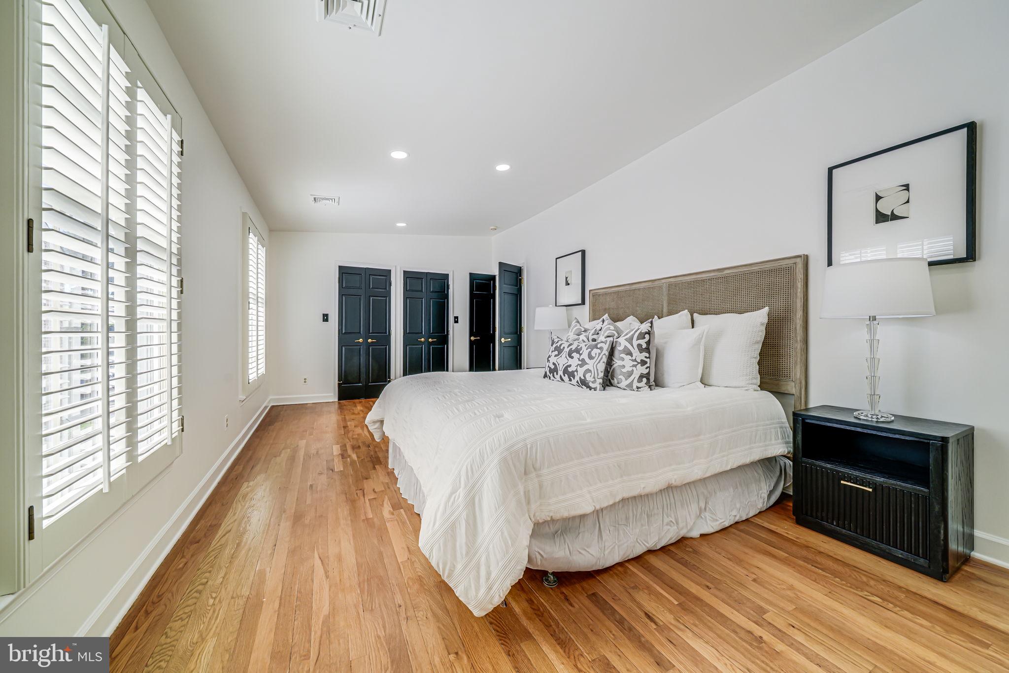 4817 Chevy Chase Boulevard Chevy Chase, MD 20815 - Photo 26 of 78 a bedroom with a bed and a large window