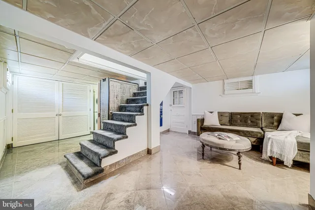 a view of a chair and table in back yard of the house