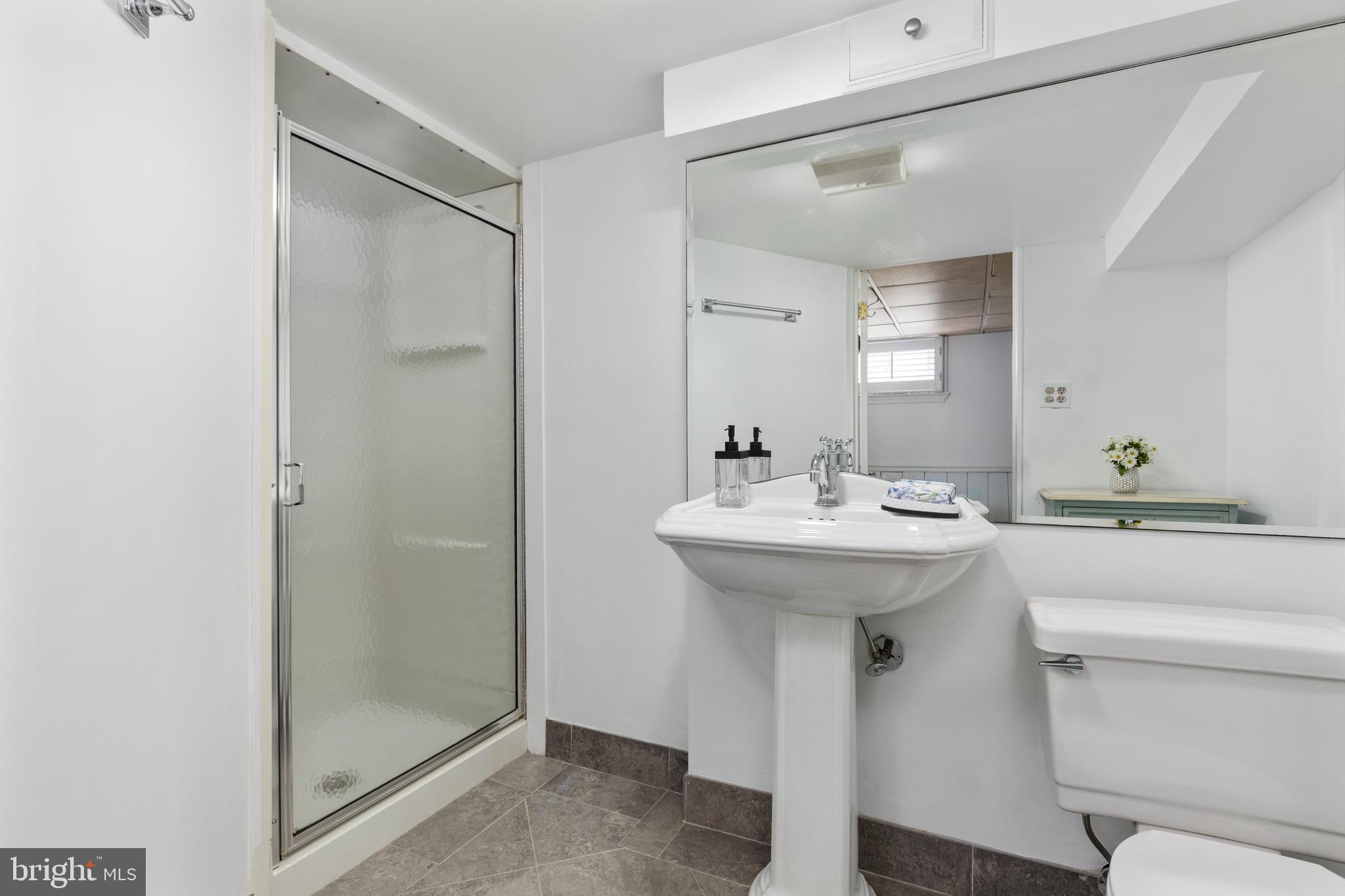 4817 Chevy Chase Boulevard Chevy Chase, MD 20815 - Photo 42 of 78 a bathroom with a sink toilet and shower