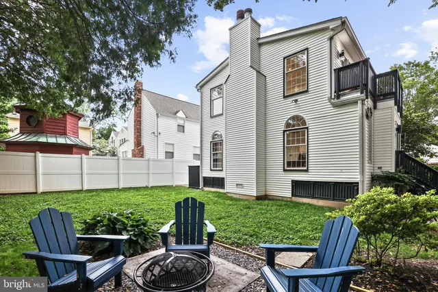 a view of a yard with plants and a trees