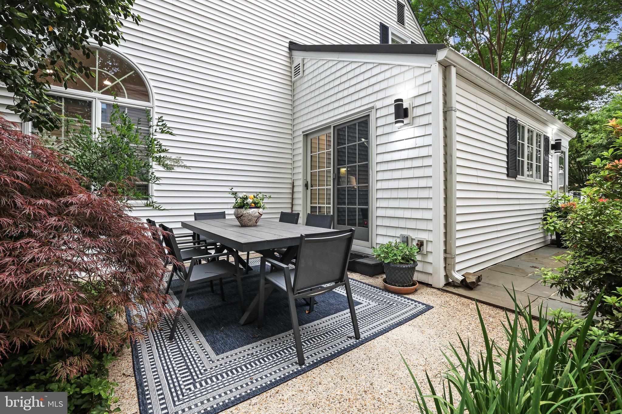 4817 Chevy Chase Boulevard Chevy Chase, MD 20815 - Photo 47 of 78 a backyard of a house with table and chairs