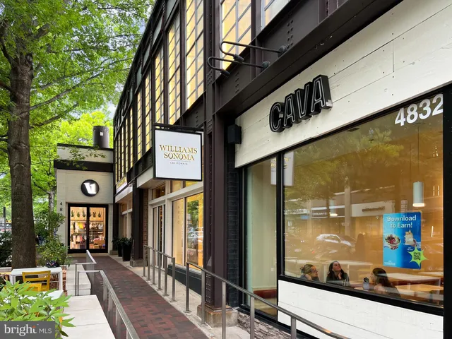 a front view of a house with porch and garden