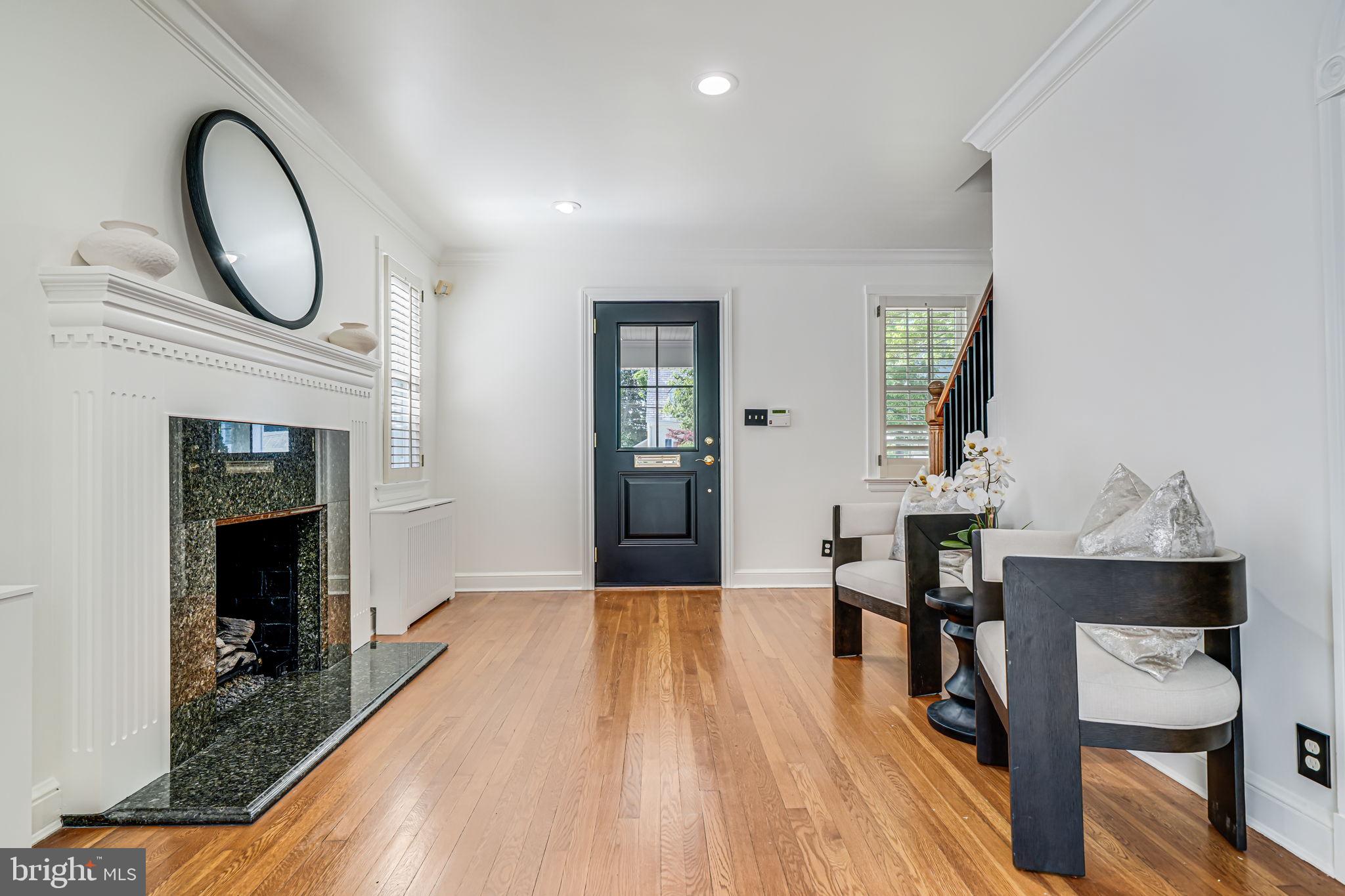 4817 Chevy Chase Boulevard Chevy Chase, MD 20815 - Photo 6 of 78 a living room with furniture and a fireplace