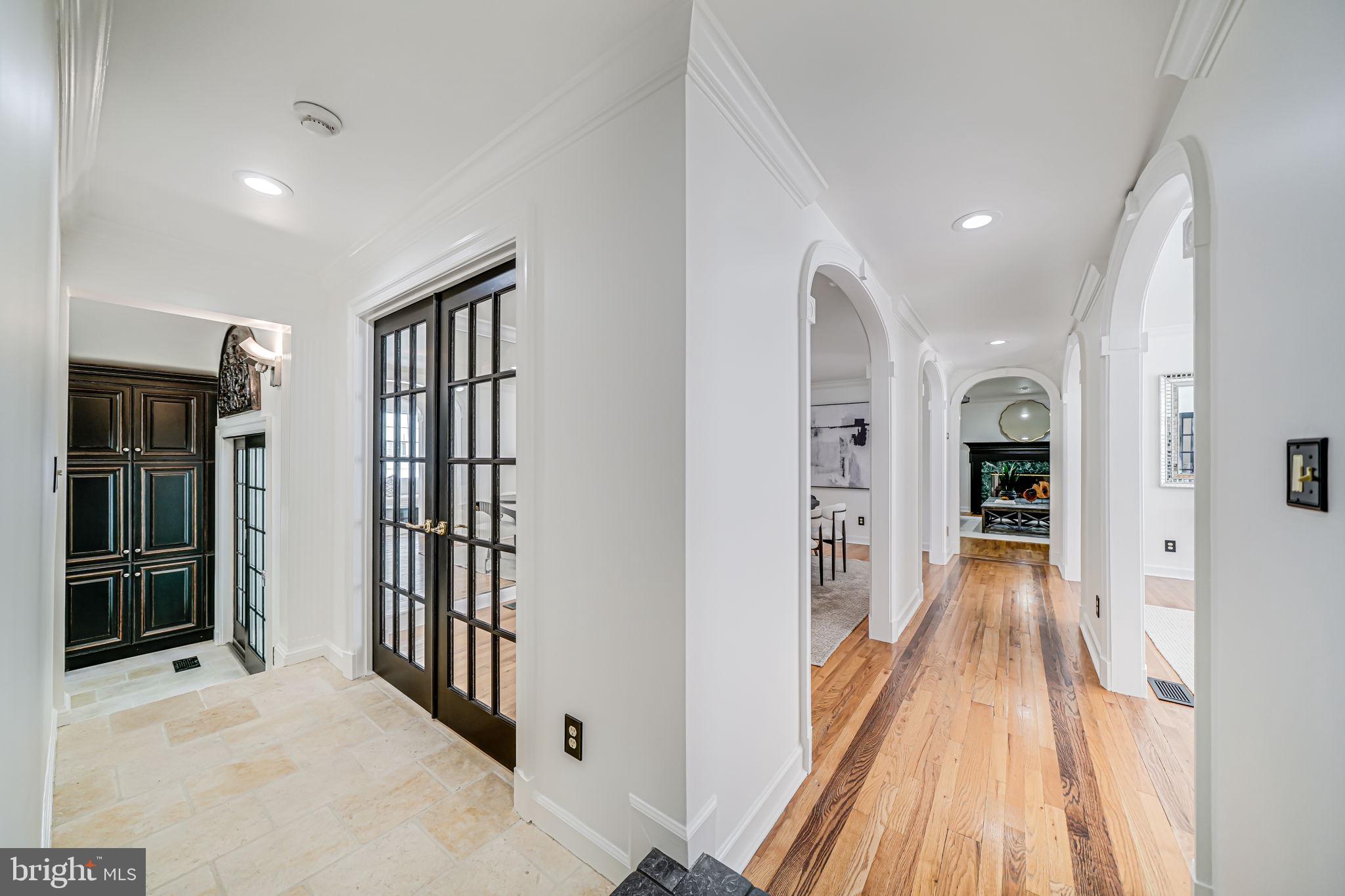 4817 Chevy Chase Boulevard Chevy Chase, MD 20815 - Photo 9 of 78 a view of a hallway with wooden floor and windows