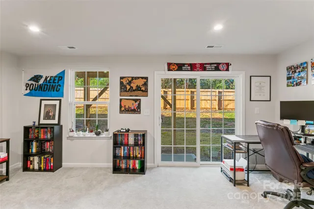 a room with furniture and a flat screen tv