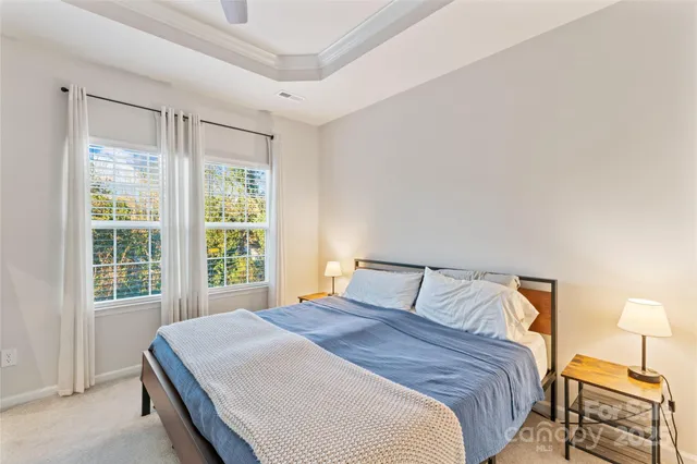 a bedroom with a bed and a lamp