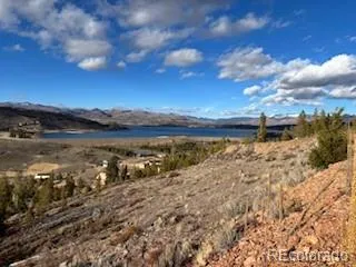 a view of a lake with sunset in back