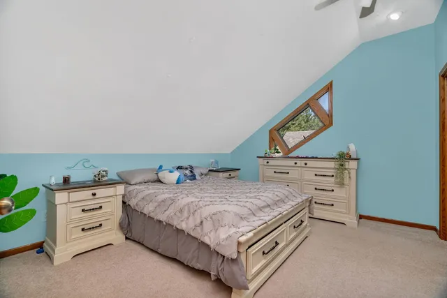 a living room with furniture and a ceiling fan