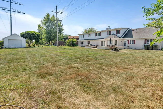 a view of a patio with a table chairs and a table