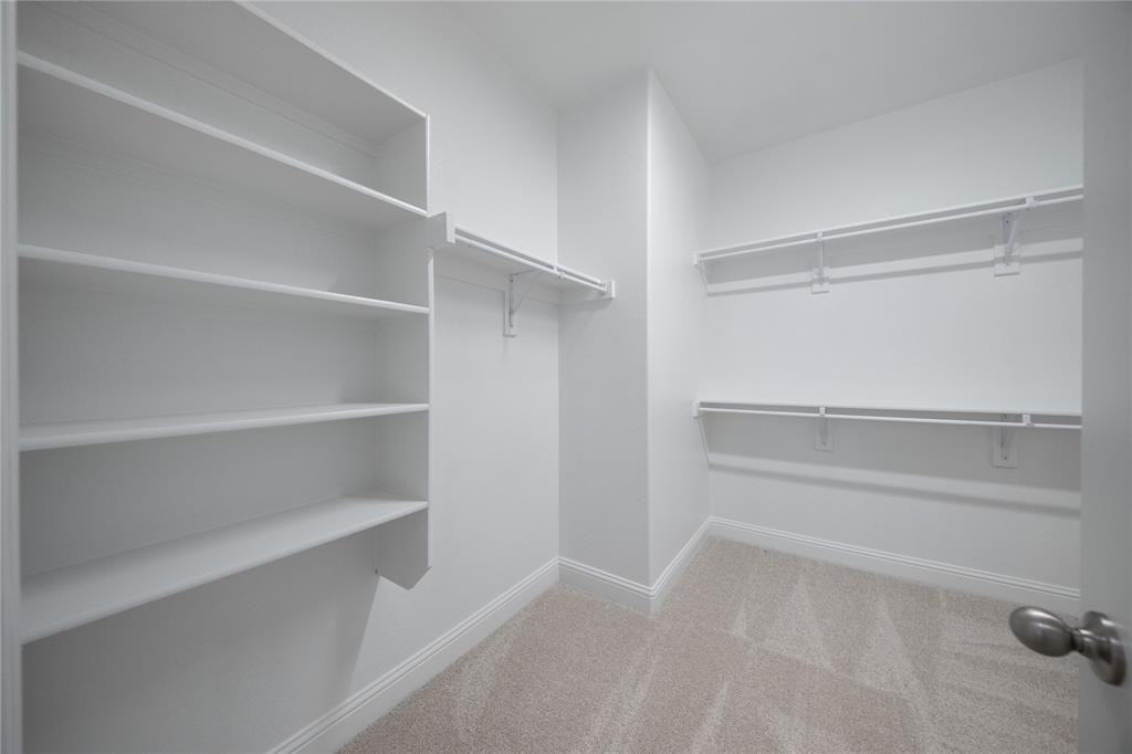 102 National Court Forney, TX 75126 - Photo 13 of 26 a view of an empty walk in closet