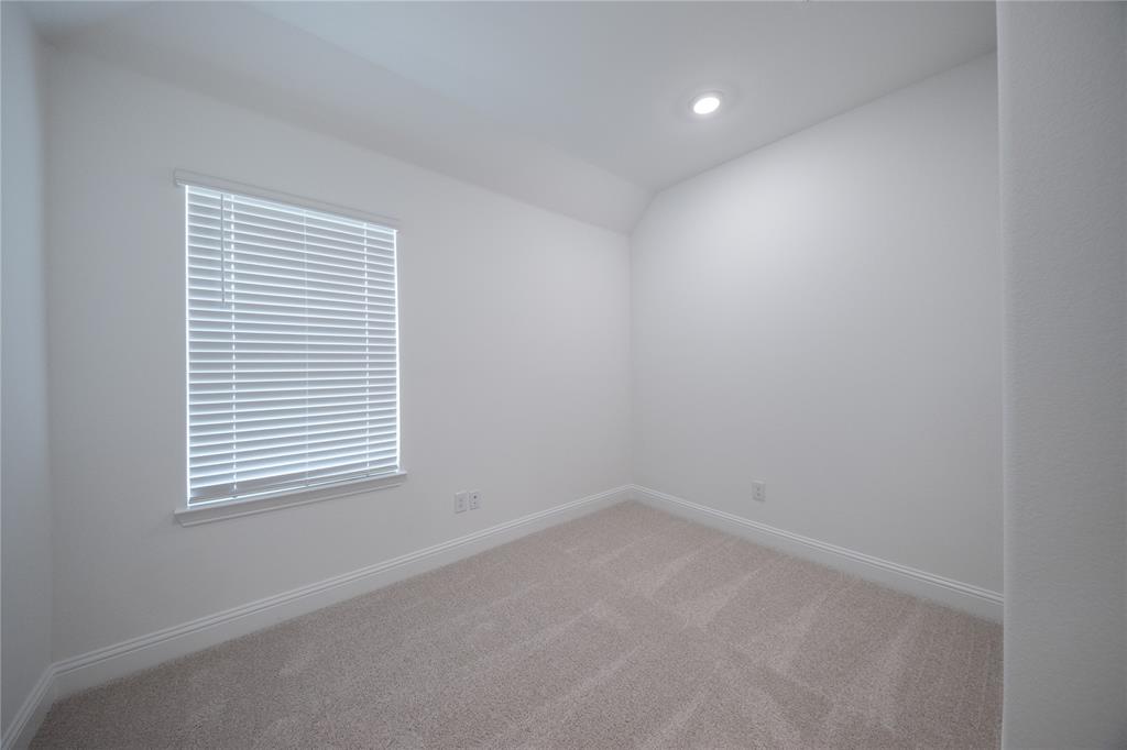 102 National Court Forney, TX 75126 - Photo 14 of 26 an empty room with a window