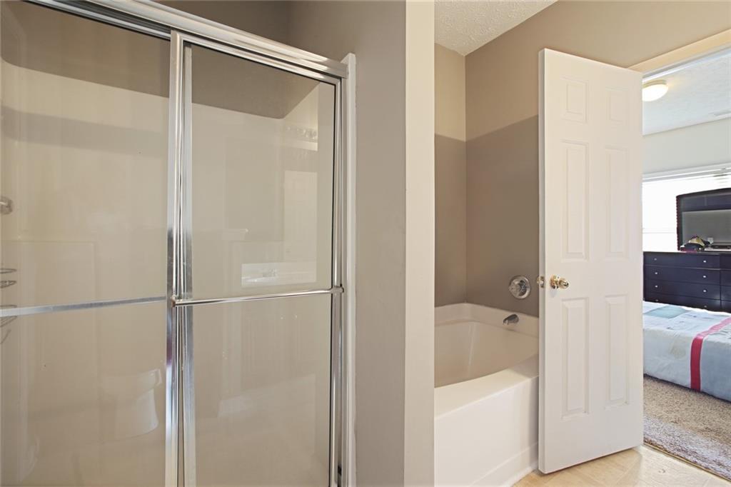 2555 Flat Shoals Road, Unit 1801 Atlanta, GA 30349 - Photo 14 of 24 a bathroom with a tub and a bathroom view