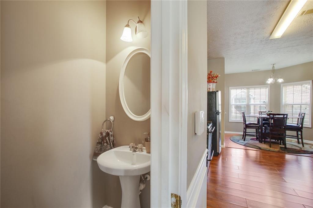 2555 Flat Shoals Road, Unit 1801 Atlanta, GA 30349 - Photo 15 of 24 a bathroom with a sink and a mirror