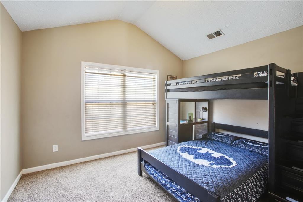 2555 Flat Shoals Road, Unit 1801 Atlanta, GA 30349 - Photo 16 of 24 a living room with hard wood floor and a window