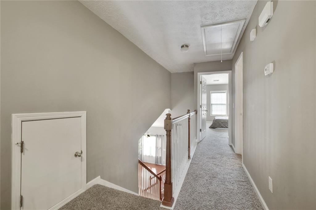 2555 Flat Shoals Road, Unit 1801 Atlanta, GA 30349 - Photo 19 of 24 a view of a hallway with windows