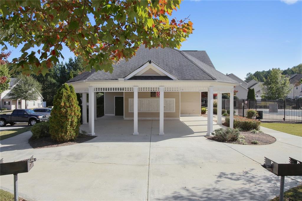 2555 Flat Shoals Road, Unit 1801 Atlanta, GA 30349 - Photo 22 of 24 a front view of a house with garden