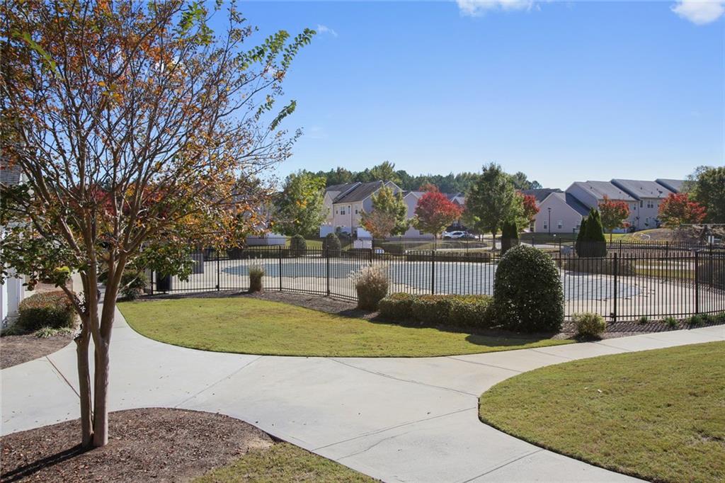 2555 Flat Shoals Road, Unit 1801 Atlanta, GA 30349 - Photo 23 of 24 a view of a swimming pool with a bench in the patio