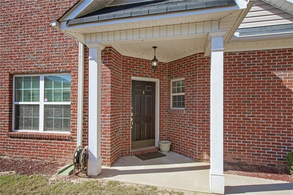 2555 Flat Shoals Road, Unit 1801 Atlanta, GA 30349 - Photo 3 of 24 a front view of a house with a door