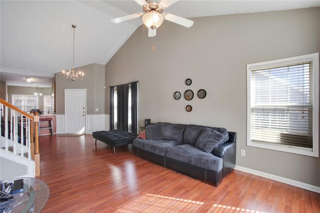 2555 Flat Shoals Road, Unit 1801 Atlanta, GA 30349 - Photo 7 of 24 a living room with furniture and wooden floor
