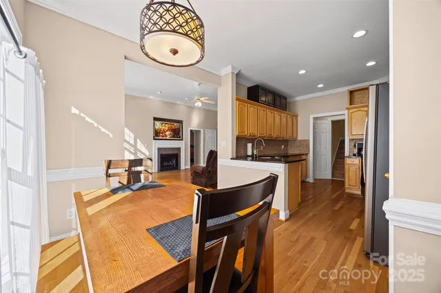 a large kitchen with a table and chairs