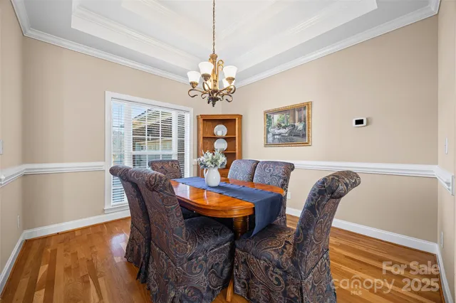 a view of a dining room with furniture and window
