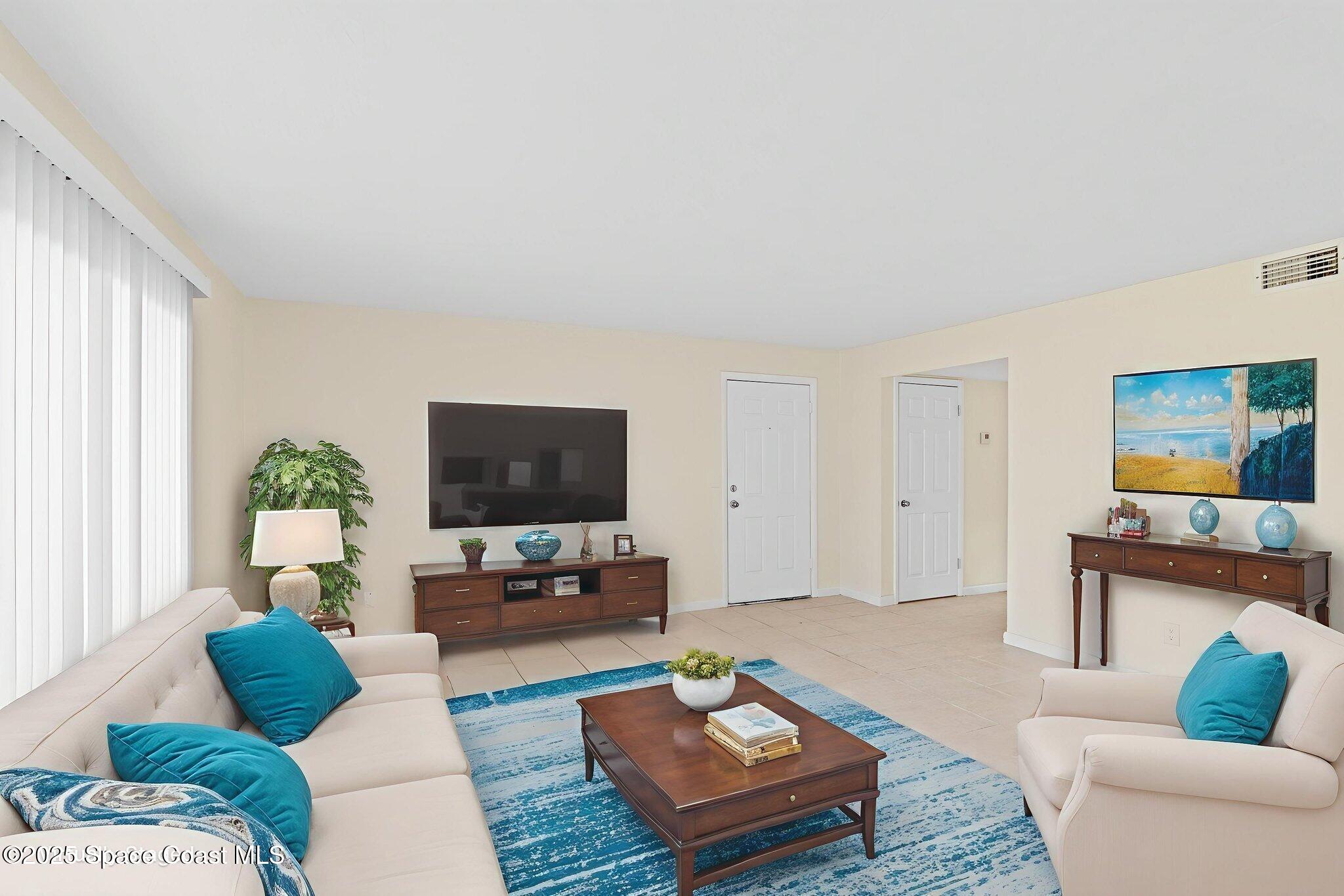 1870 Agora Circle Southeast, Unit 103 Palm Bay, FL 32909 - Photo 5 of 18 Living Room