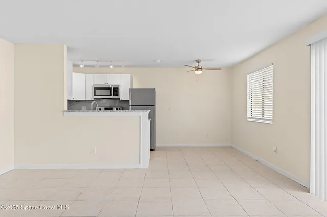 a view of a kitchen with microwave and cabinets