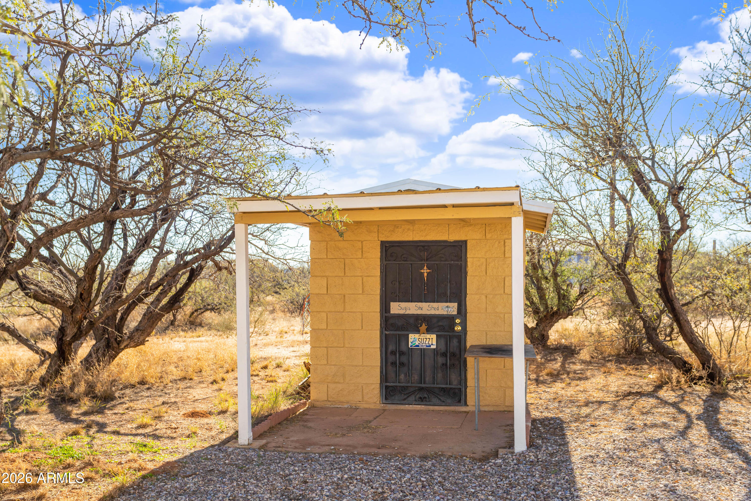 5681 South Moson Road Hereford, AZ 85615 - Photo 9 of 47 a view of a house with a yard