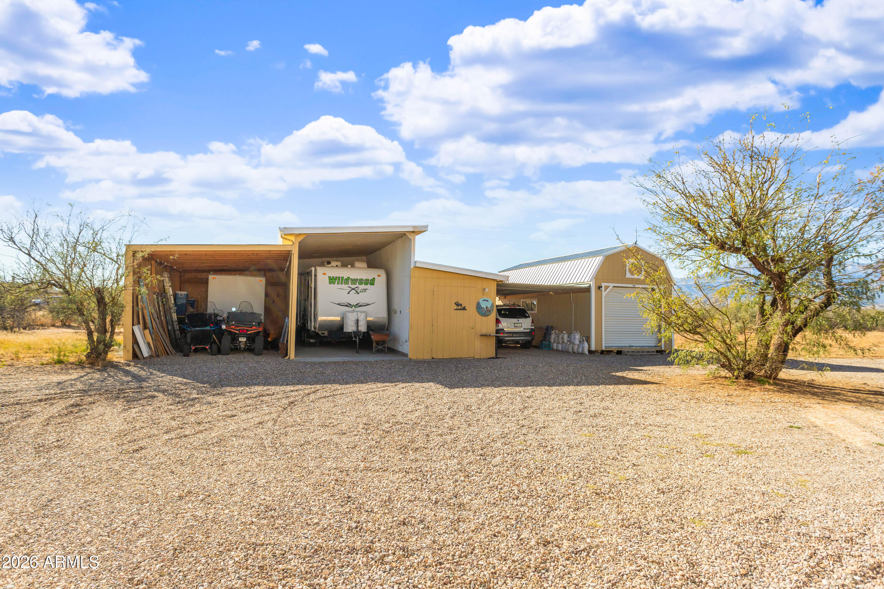 5681 South Moson Road Hereford, AZ 85615 - Photo 10 of 47 a view of a house with a snow in the yard