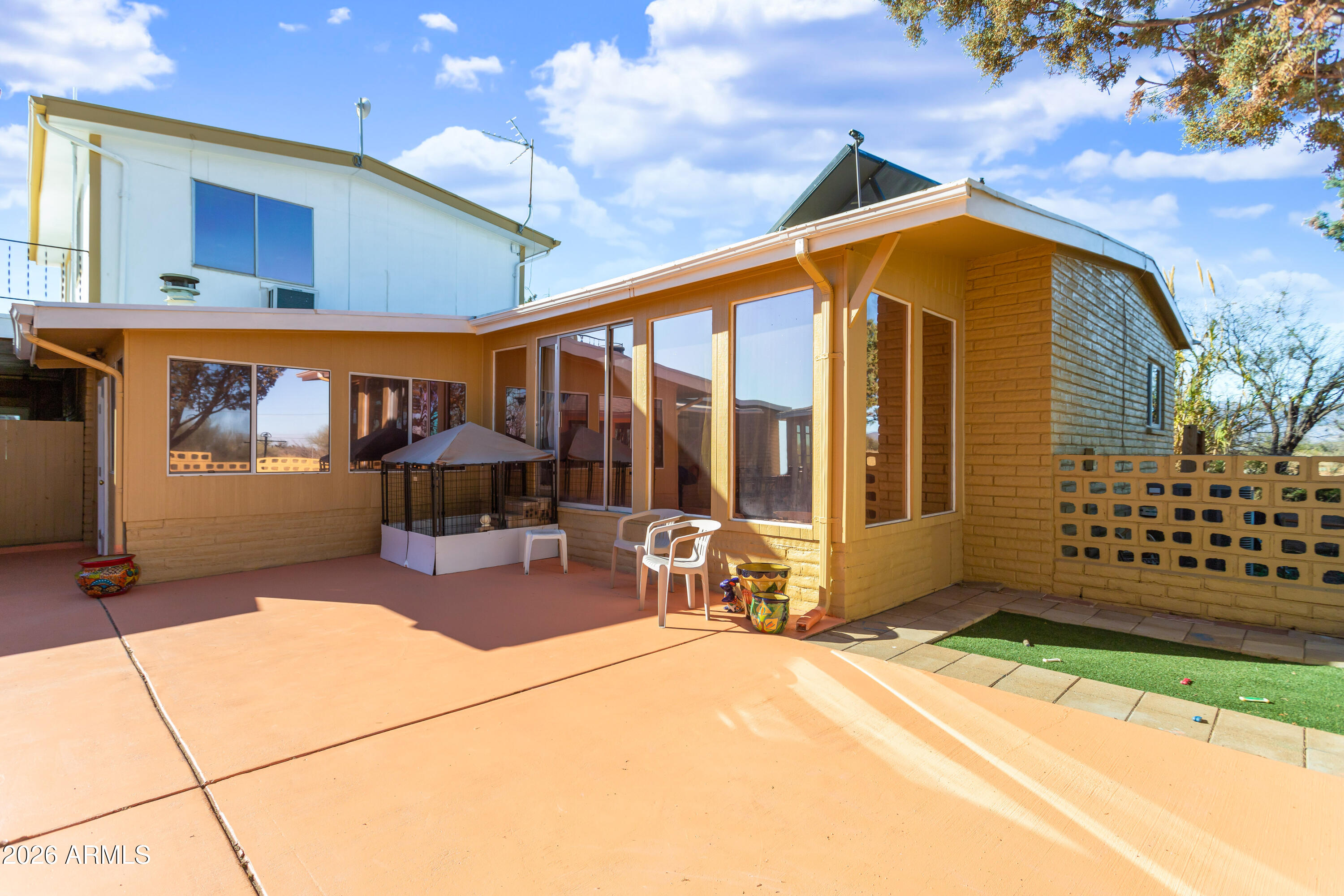5681 South Moson Road Hereford, AZ 85615 - Photo 12 of 47 a view of a house with backyard and sitting area