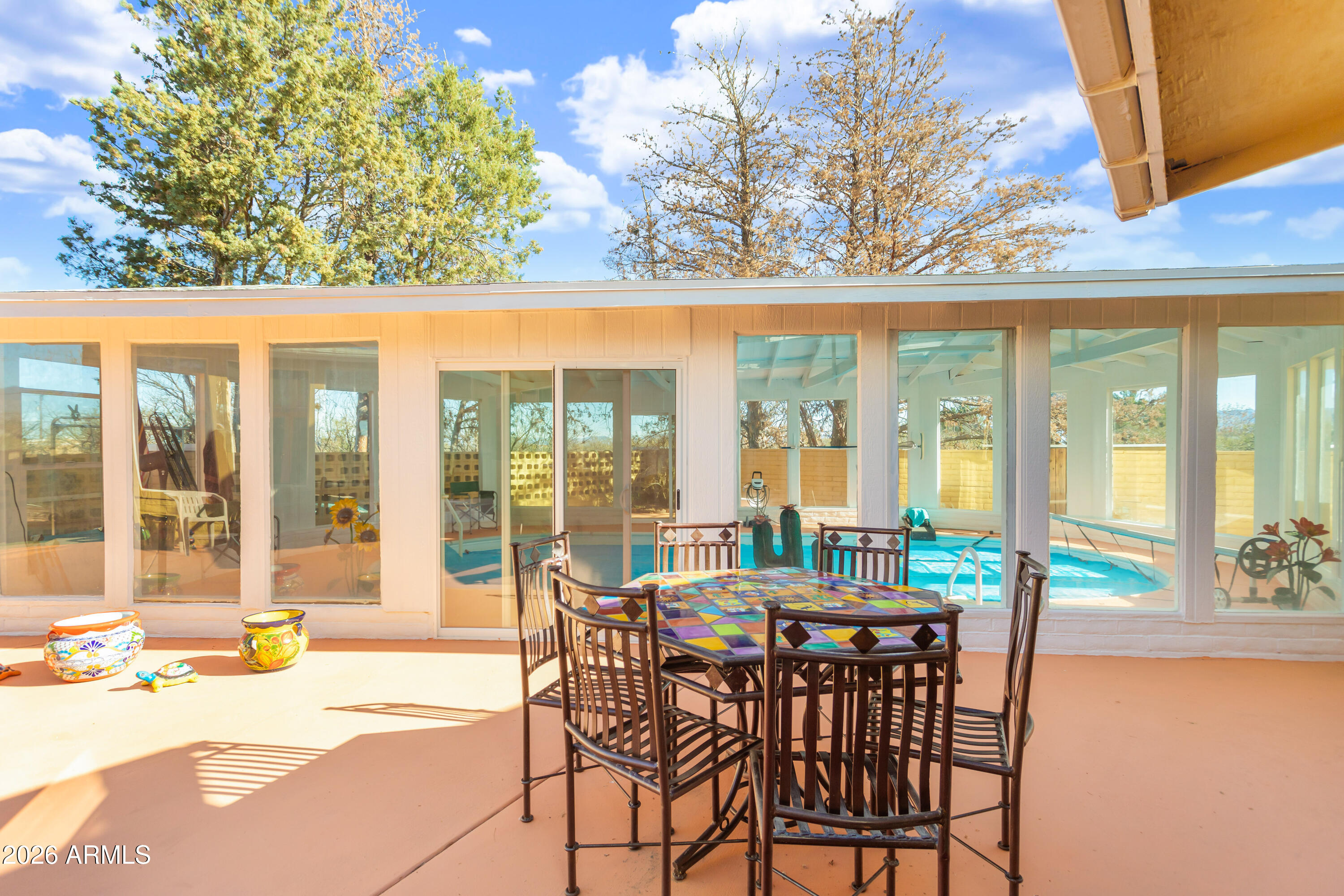 5681 South Moson Road Hereford, AZ 85615 - Photo 15 of 47 a view of a patio with a table and chairs