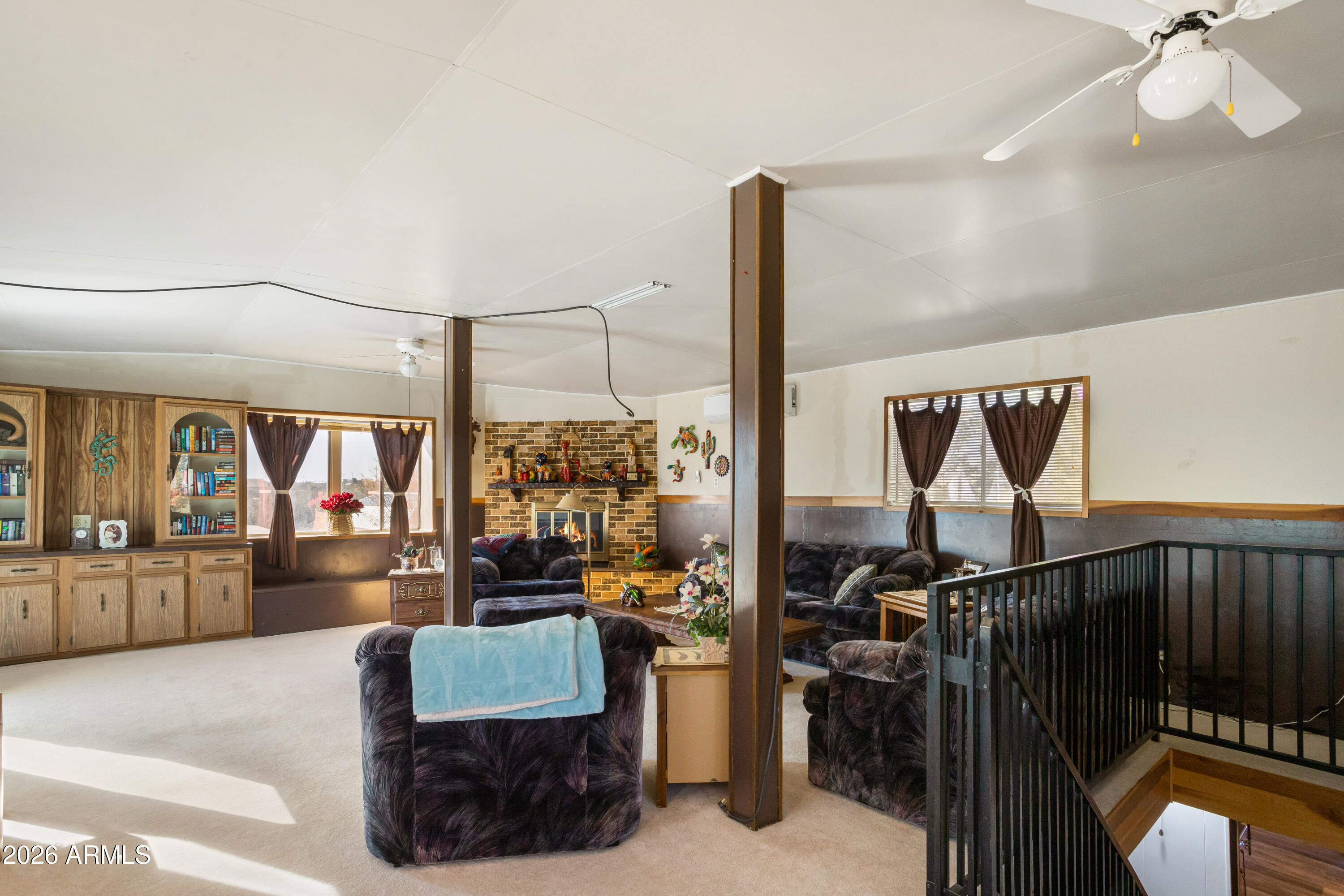 5681 South Moson Road Hereford, AZ 85615 - Photo 19 of 47 a living room with furniture and a flat screen tv
