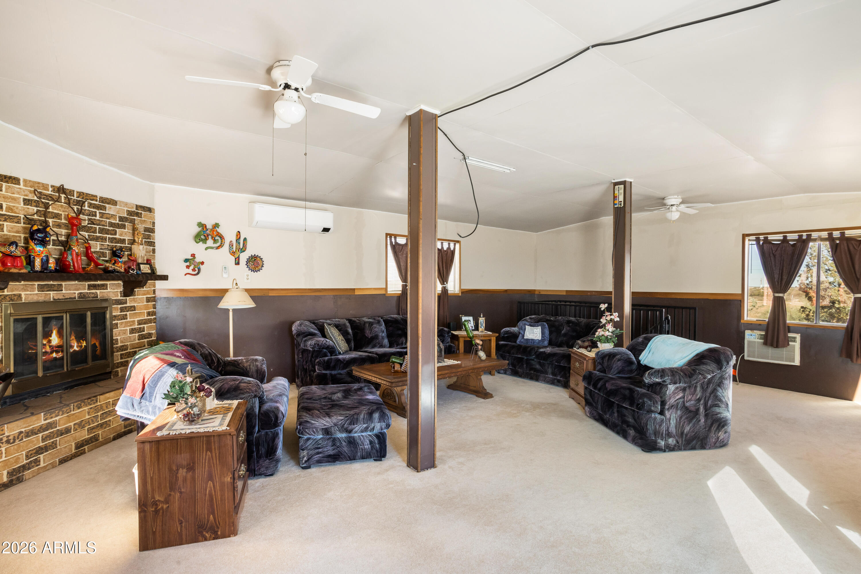 5681 South Moson Road Hereford, AZ 85615 - Photo 21 of 47 a living room with furniture and a fireplace