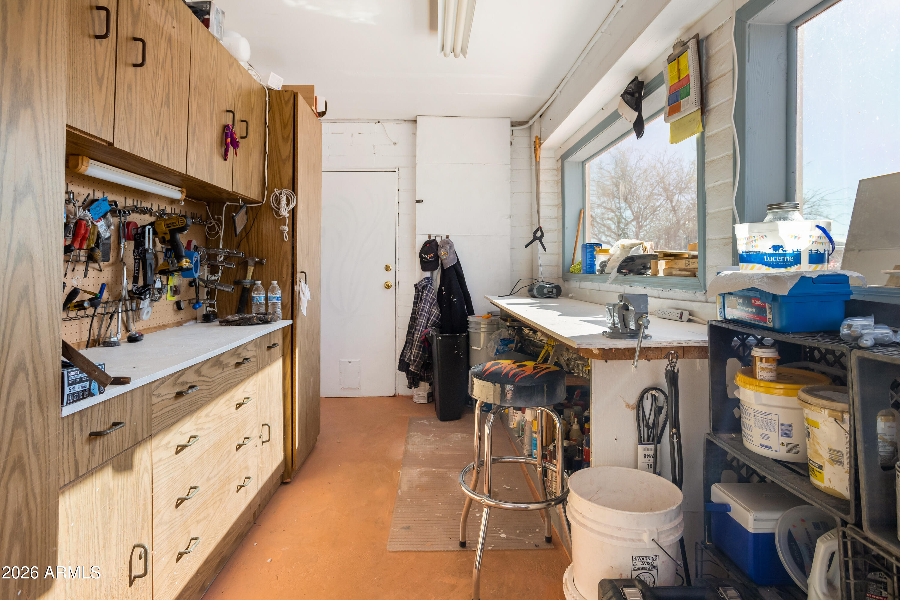 5681 South Moson Road Hereford, AZ 85615 - Photo 24 of 47 a bathroom with a granite countertop sink a toilet and a mirror