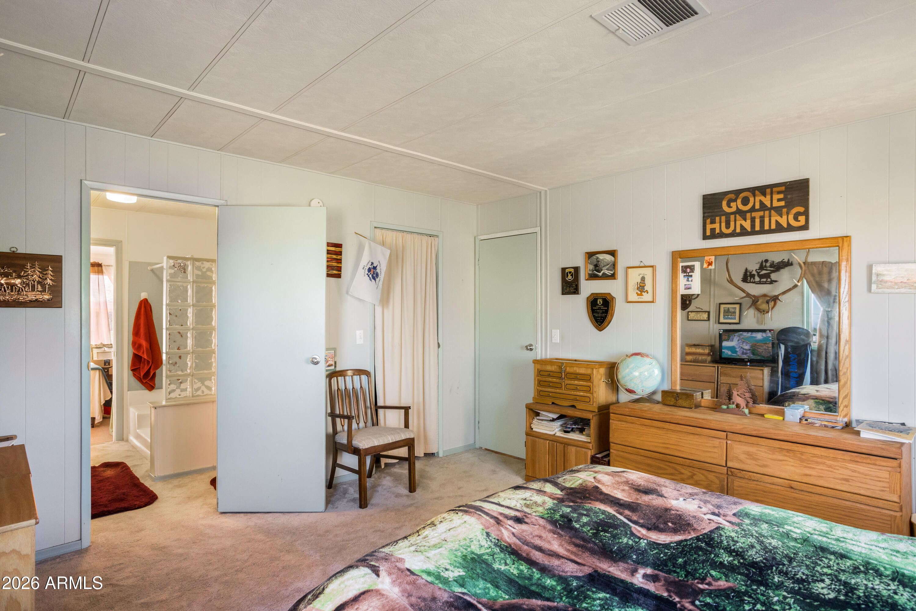 5681 South Moson Road Hereford, AZ 85615 - Photo 28 of 47 a bedroom with furniture and a bathroom
