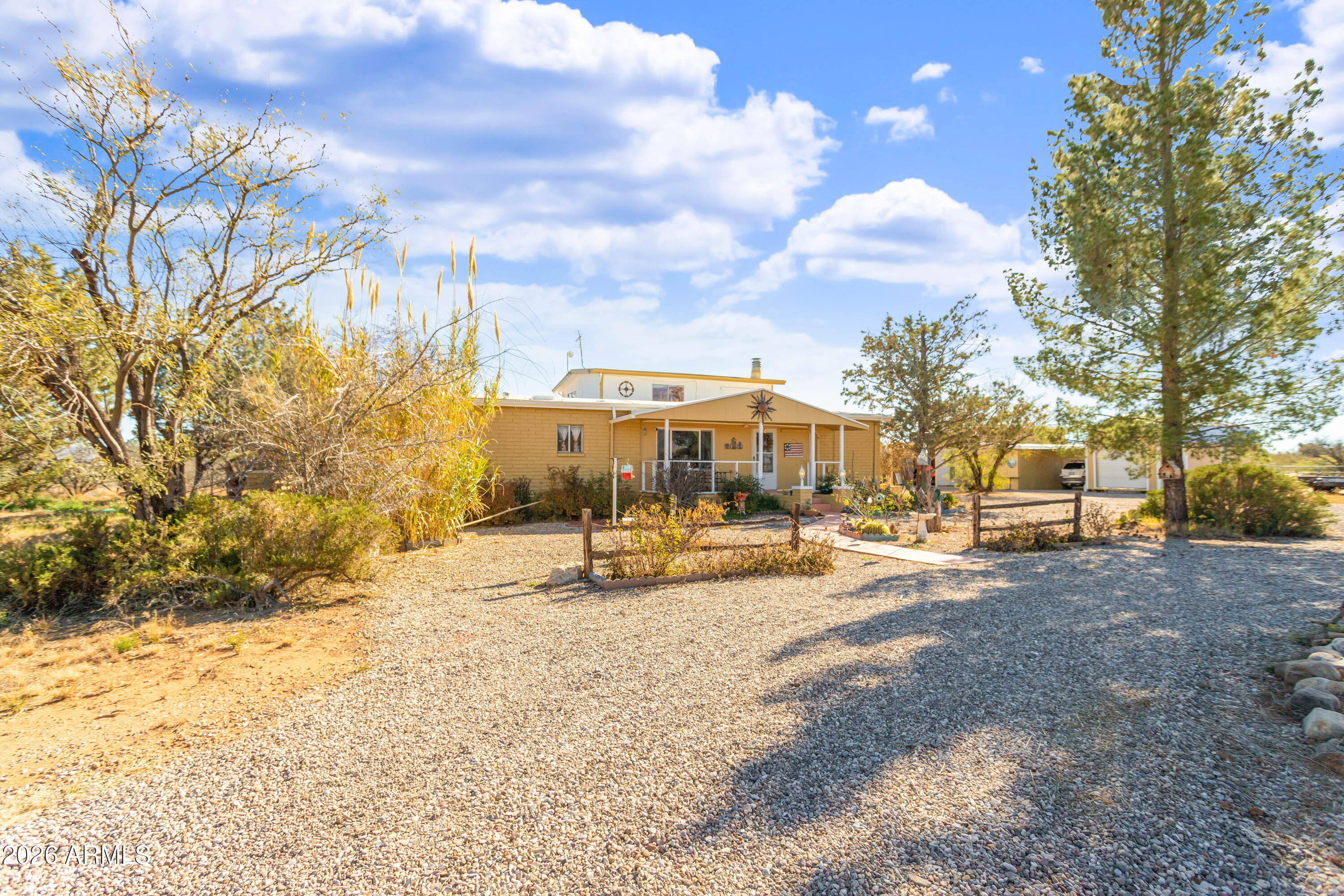 5681 South Moson Road Hereford, AZ 85615 - Photo 2 of 47 a view of a yard with snow on the road